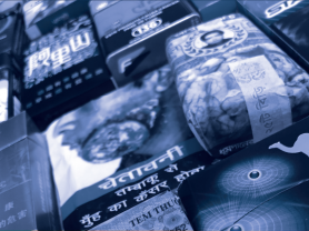 various cigarette packs with health warning labels. 