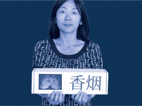 Woman holding gift of cigarettes