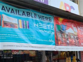 HTP and cigarette banner ads displayed outside a retail location in Metro Manila