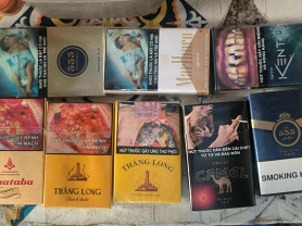 Cigarette packs displayed on a table in Vietnam