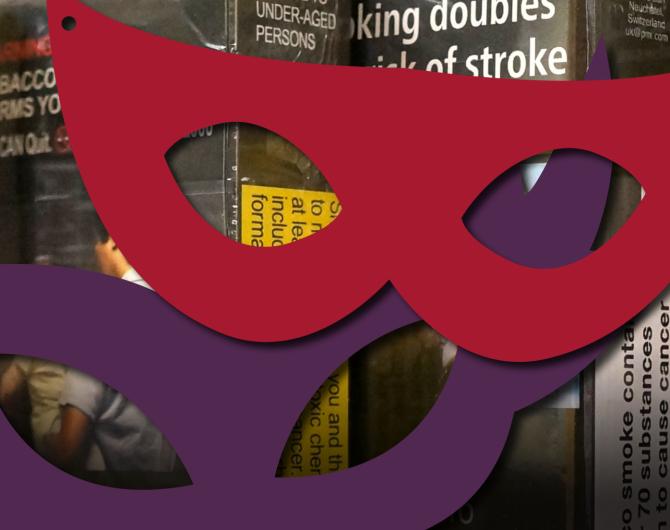 Two theatrical masks obscure the warning labels on plain and standardized cigarette packs